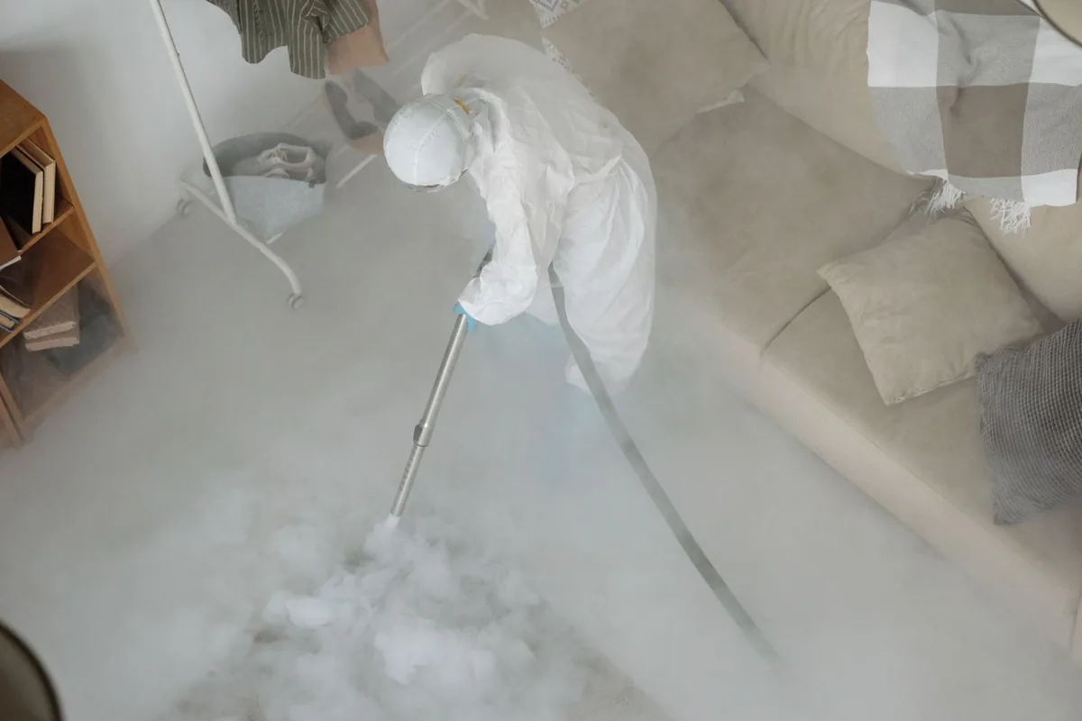Biohazard cleanup technician in protective equipment, Palmer Town, MA